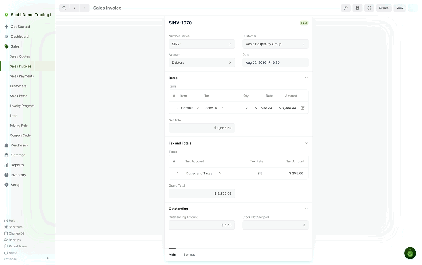 The same invoice after the payment — the badge reads Paid and Outstanding Amount has fallen to $ 0.00