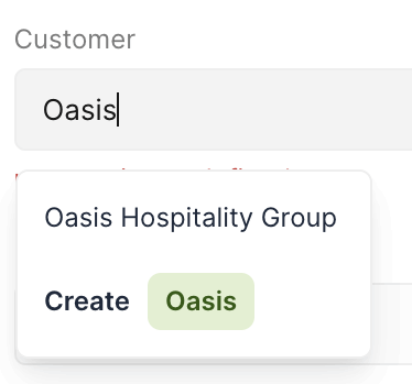 The Customer field with "Oasis" typed — the matching customer above, and the inline Create option that adds a new customer under that name without leaving the invoice
